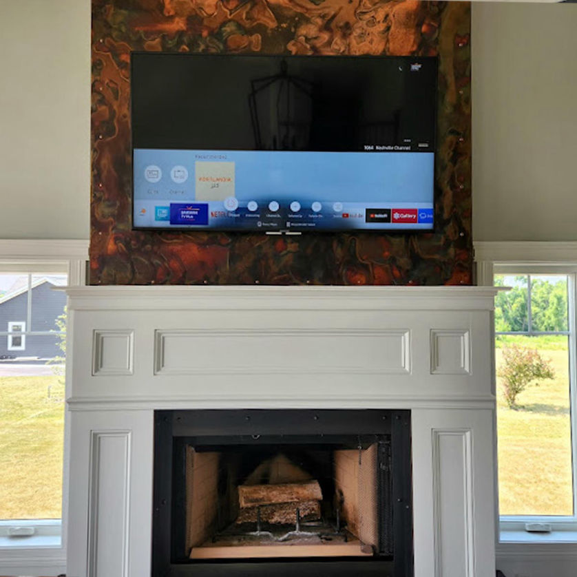 TV mounted over a fireplace